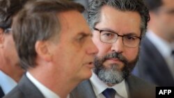 Brazilian President-elect Jair Bolsonaro, left, and his newly appointed foreign minister, Brazilian diplomat Ernesto Araujo, are pictured in Brasilia, on Nov. 14, 2018.