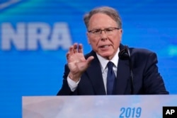 FILE - Nation Rifle Association Executive Vice President Wayne LaPierre speaks at the National Rifle Association Institute for Legislative Action Leadership Forum in Lucas Oil Stadium in Indianapolis, April 26, 2019.