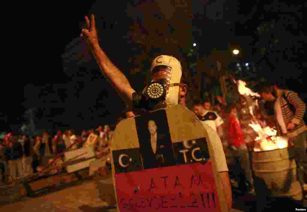 An anti-government protester gestures during a demonstration in central Ankara, June 9, 2013. 