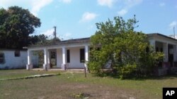 FILE - This March 20, 2015, photo shows a house that used to belong to U.S. citizen Daniel Smith in the Isle of Pines, Cuba. The property was confiscated by the Cuban government after the revolution.