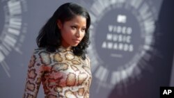 FILE - Nicki Minaj arrives at the MTV Video Music Awards on Aug. 24, 2014, in Inglewood, California. 