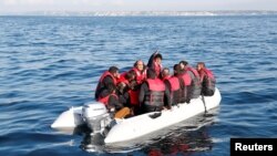 Migrants who launched from the coast of northern France cross the English Channel in an inflatable boat near Dover, Britain, Aug. 4, 2021. 