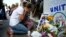A woman reacts at a makeshift memorial outside the Al Noor mosque in Christchurch, New Zealand, March 23, 2019.