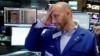 Specialist Meric Greenbaum works at his post on the floor of the New York Stock Exchange, June 24, 2016. 