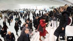 Commuters pass through the World Trade Center in New York, Dec. 4, 2019. A study by a U.S. agency has found that facial recognition technology often performs unevenly based on a person's race, gender or age.