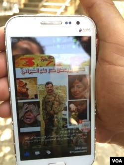 Moorad Aloo shows a picture of his brother who stayed behind to fight IS militants in August 2014 when the extremists launched an assault against the religious minority. Aloo never saw his brother again. Lalish, Iraq, July 31, 2015. (Photo - S. Behn/VOA)