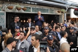 Israeli Prime Minister Benjamin Netanyahu, leader of the Likud party, addresses his supporters at the main market of Jerusalem, April 8, 2019.