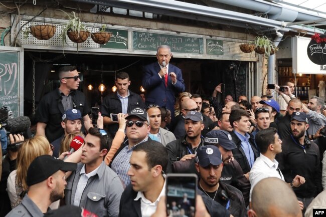 Israeli Prime Minister Benjamin Netanyahu, leader of the Likud party, addresses his supporters at the main market of Jerusalem, April 8, 2019.