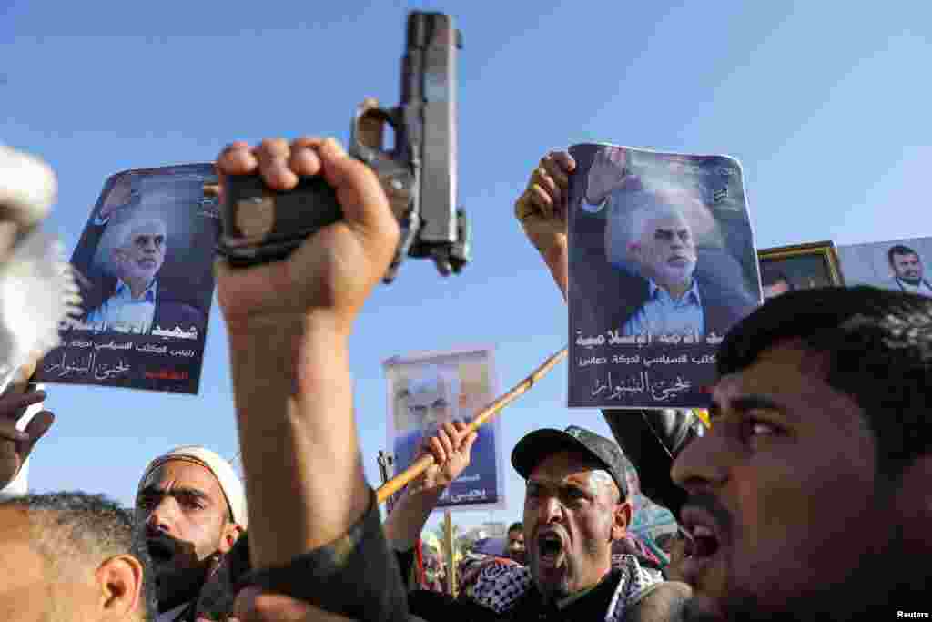 Protesters, mainly Houthi supporters, hold signs showing the late Hamas leader Yahya Sinwar as they rally to show support to Lebanon&#39;s Hezbollah and Palestinians in the Gaza Strip, in Sanaa, Yemen.