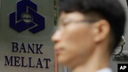 FILE - British justices ruled the government was wrong to impose sanctions on Bank Mellat, the biggest Iranian private bank, over alleged links to Tehran's nuclear program. 