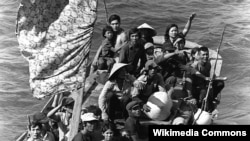 Vietnamese boat people rescued northeast of Cam Ranh Bay, Vietnam, after spending eight days at sea. 15 May 1984. (US Navy)
