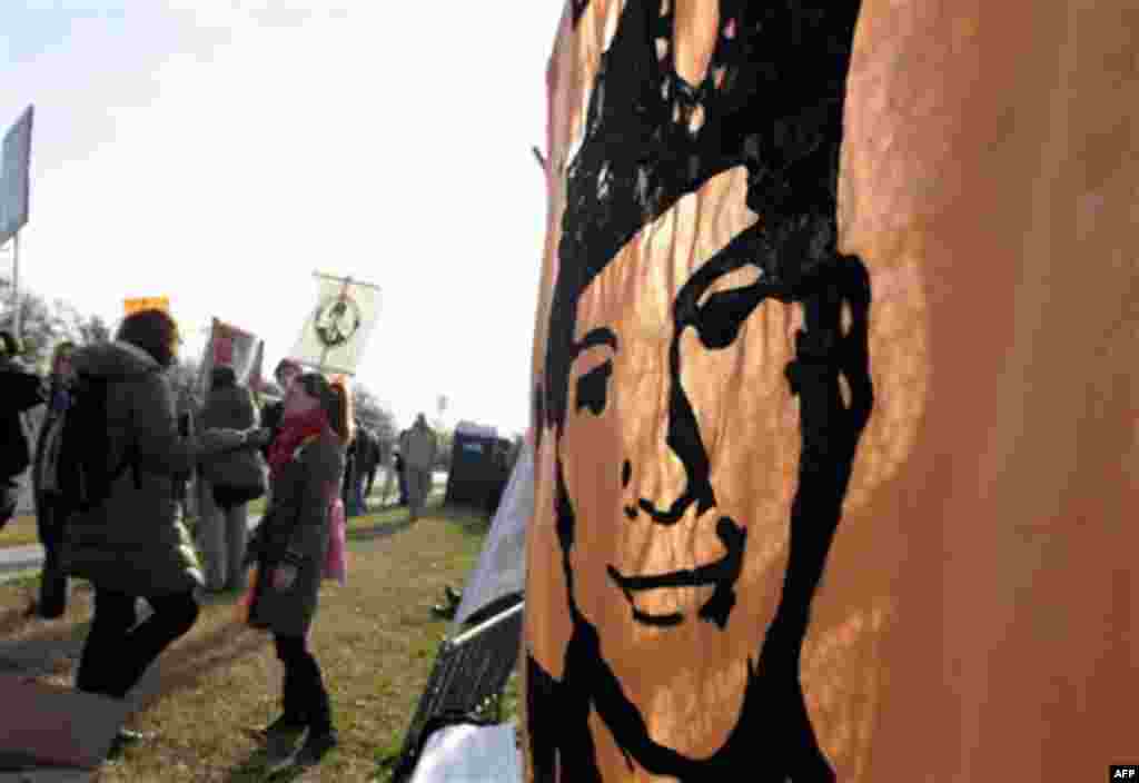 Protestors supporting Bradley Manning gather outside Ft. Meade, Md., Friday, Dec. 16, 2011, where Manning will be attending a hearing to determine if he will be court martialed. (AP Photo/Susan Walsh)