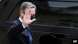 [FILE] U.S. Secretary of State Antony Blinken waves after his talks with French President Emmanuel Macron at the Elysee palace, June 25, 2021.