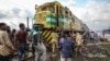 Cattle are offloaded from a freight train at the Oko-Oba abattoir in Lagos, Nigeria, Sept. 3, 2016. (C. Stein/VOA)