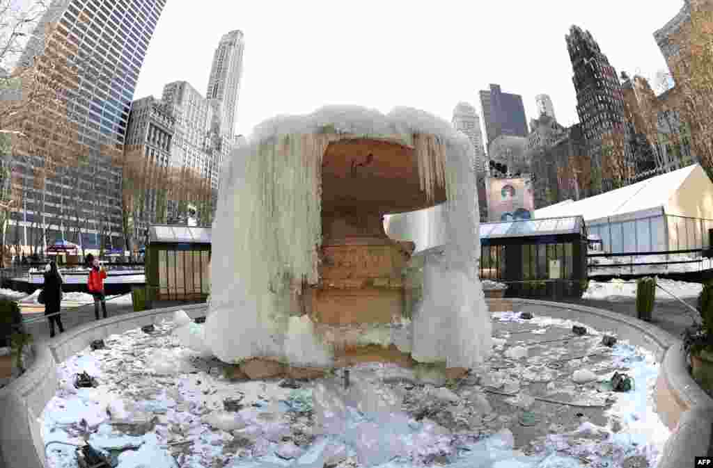 The Josephine Shaw Lowell Fountain in Bryant Park in New York remains frozen. The temperature in Central Park Friday morning was 2 degrees Fahrenheit (-16.6C). The previous record for this date was 7 degrees Fahrenheit (-13.8C), set in 1950.