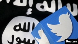 FILE - A 3-D printed logo of Twitter and an Islamic State flag are seen in this picture illustration taken Feb. 18, 2016. 