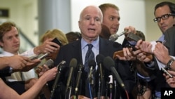 Senate Armed Service Committee member Sen. John McCain, speaks to reporters on Capitol Hill, July 8, 2014.