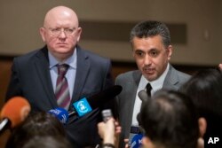 UN SRussian Ambassador to the United Nations Vassily Nebenzia (L) and Bolivian Ambassador to the United Nations Sacha Llorenty speak to reporters in after Security Council consultations of the situation in Syria, April 12, 2018, at United Nations headquar