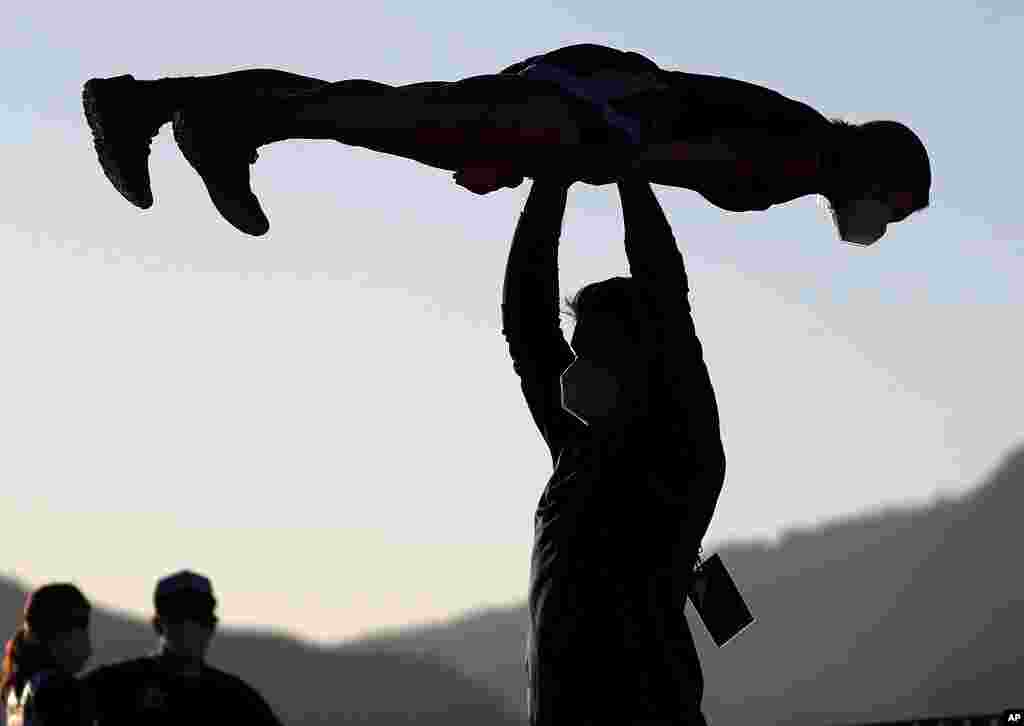 Athletes practice for the ski jumping event at the FIS Nordic World Ski Championships in Oberstdorf, Germany.