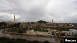 FILE - A general view shows the town of Azaz, near the Syrian-Turkish border, March 11, 2014. 