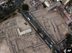 FILE - The pre-Columbian archeological site Pucllana is divided by Independence Street in the Miraflores district of Lima, Peru, Oct. 6 2017.