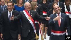 FILE - Peru's President Pedro Pablo Kuczynski, center, walks with Prime Minister Fernando Zavala, right, and first Vice President Martin Vizcarra, left, to Congress in Lima, Peru, July 28, 2017. Kuczynski delivered his first State of the Nation address to Congress.