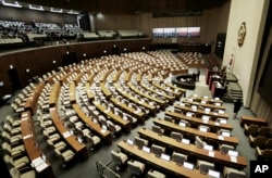 FILE - Rep. Choi Won-sik, second from right, of the opposition People's Party, speaks at the National Assembly in Seoul, South Korea, Monday, Feb. 29, 2016.