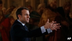 French President Emmanuel Macron speaks at the Elysee Palace in Paris, March 26, 2018.