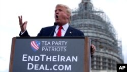 FILE - Then-presidential candidate Donald Trump speaks at a rally organized by Tea Party Patriots on Capitol Hill in Washington, Sept. 9, 2015, to oppose the Iran nuclear agreement. 