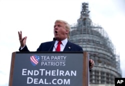 FILE - Then-Republican presidential candidate Donald Trump speaks at a rally organized by Tea Party Patriots on Capitol Hill in Washington, Sept. 9, 2015, to oppose the Iran nuclear agreement.