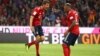 Thomas Mueller (G) et Jerome Boateng du Bayern Munich jubilent après leur but, lors d’un match de la bundesliga, le 24 août 2018. 