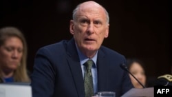 FILE - Director of National Intelligence Dan Coats testifies on worldwide threats during a Senate Intelligence Committee hearing on Capitol Hill in Washington, Feb. 13, 2018.