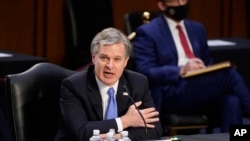 FBI Director Christopher Wray testifies before the Senate Judiciary Committee on Capitol Hill in Washington, Tuesday, March 2, 2021. Wray is condemning the Jan. 6 riot at the Capitol as “domestic terrorism.” (AP Photo/Patrick Semansky) 