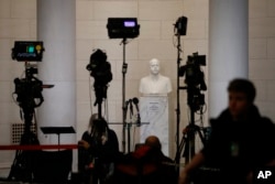 FILE - Television news equipment near a hearing room Monday, Dec. 9, 2019, on Capitol Hill in Washington. (AP Photo/Patrick Semansky)