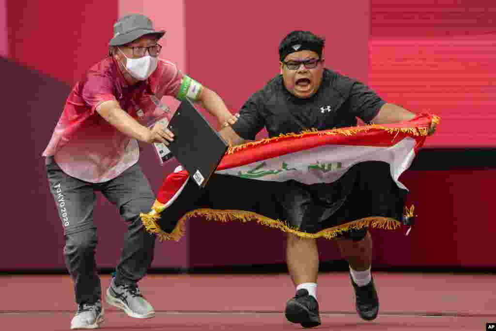 Iraq&#39;s Garrah Tnaiash reacts after a throw in the men&#39;s F40 shot put final during the 2020 Paralympics at the National Stadium in Tokyo, Japan.