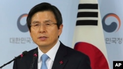 FILE - Acting South Korean President Hwang Kyo-ahn speaks during a press conference at the government complex in Seoul, South Korea, Dec. 9, 2016.