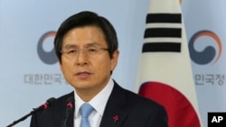 FILE - Acting South Korean President Hwang Kyo-ahn speaks during a press conference at the government complex in Seoul, South Korea, Dec. 9, 2016.