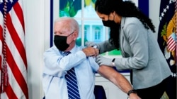 President Joe Biden receives a COVID-19 booster shot during an event in the South Court Auditorium on the White House campus, Sept. 27, 2021, in Washington.