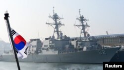 The guided missile destroyers USS Lassen (DDG 82) and USS Fitzgerald (DDG62) are seen at a South Korean naval port in Donghae, about 190 km east of Seoul, March 9, 2013 