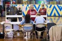 Voters prepare to cast their ballot in the Democratic primary in Philadelphia, Pennsylvania, U.S., June 2, 2020.