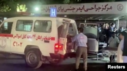 A screen grab shows an emergency vehicle as people arrive at a hospital after an attack at Kabul airport, in Kabul, Afghanistan August 26, 2021. REUTERS TV/via REUTERS