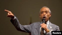 Rev. Al Sharpton speaks during a gathering to calm tension following the shooting death of black teenager Michael Brown, at Greater St. Mark Family Church in St. Louis, Missouri, August 12, 2014.