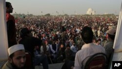 Thousands of supporters of Pakistan Tehreek-e-Insaf or or the Movement for Justice Party take part in a rally in Karachi, Pakistan on Sunday, Dec. 25, 2011.