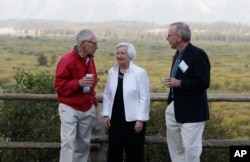 Federal Reserve Chair Janet Yellen, center, Stanley Fischer, left, vice chairman of the Board of Governors of the Federal Reserve System, and Bill Dudley, the president of the Federal Reserve Bank of New York, stroll together before Yellen's speech at Jackson Lake Lodge in Grand Teton National Park, north of Jackson Hole, Wyoming, Aug. 26, 2016.