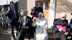 From left, Bavarian Prime Minister Horst Seehofer, Monsignor Georg Gaenswein, Pope Emeritus Benedict XVI and his brother, Georg, sit on the occasion of a party for Benedict's 90th birthday at the Vatican, April 17, 2017.