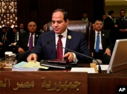 FILE - Egypt's President Abdel-Fattah el-Sissi, center, attends the summit of the Arab League at the Dead Sea, Jordan, March 29, 2017.