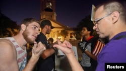 Supporters (L) of President Donald Trump argue with protesters demonstrating against him in Tallahassee, Florida, Nov. 16, 2016.