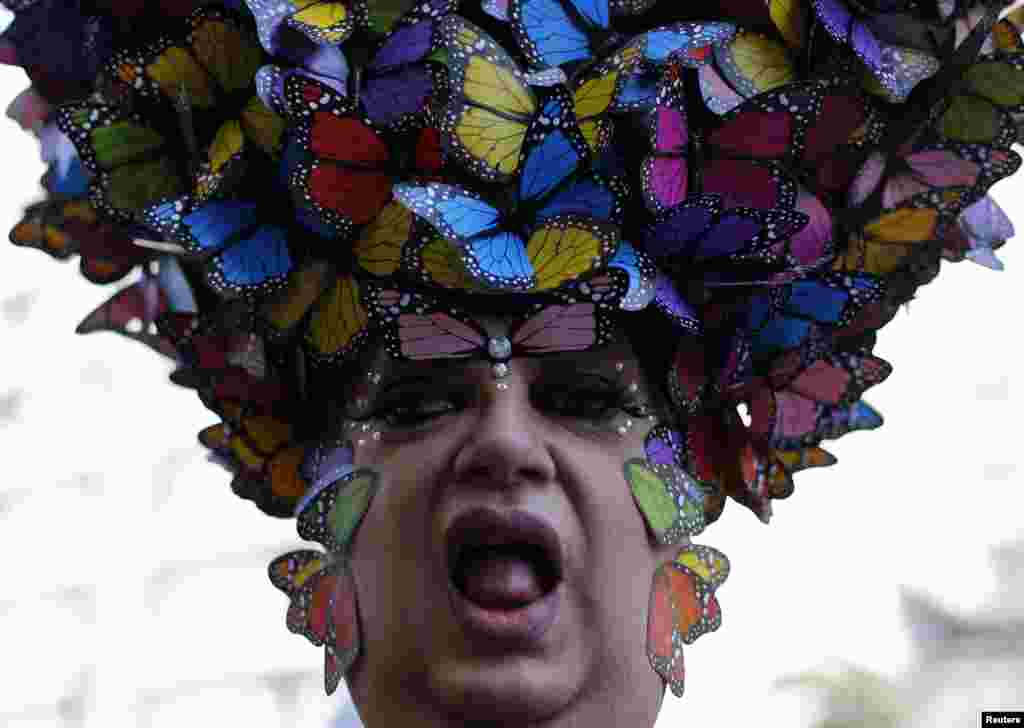 A celebrant poses during the 18th Gay Pride Parade in Sao Paulo, Brazil, May 4, 2014.