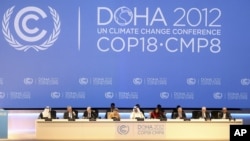 Organizers are seen on stage at the opening ceremony of the 18th United Nations climate change conference in Doha, Qatar, Nov. 26, 2012.