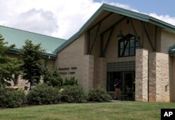 A person enters the Shenandoah Valley Juvenile Center, June 20, 2018, in Staunton, Va. Immigrant children as young as 14 housed at the juvenile detention center say they were abused.